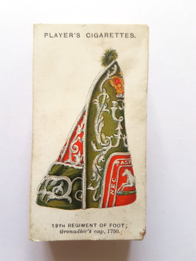 Photo of the front of these Military Head-Dress cigarette cards