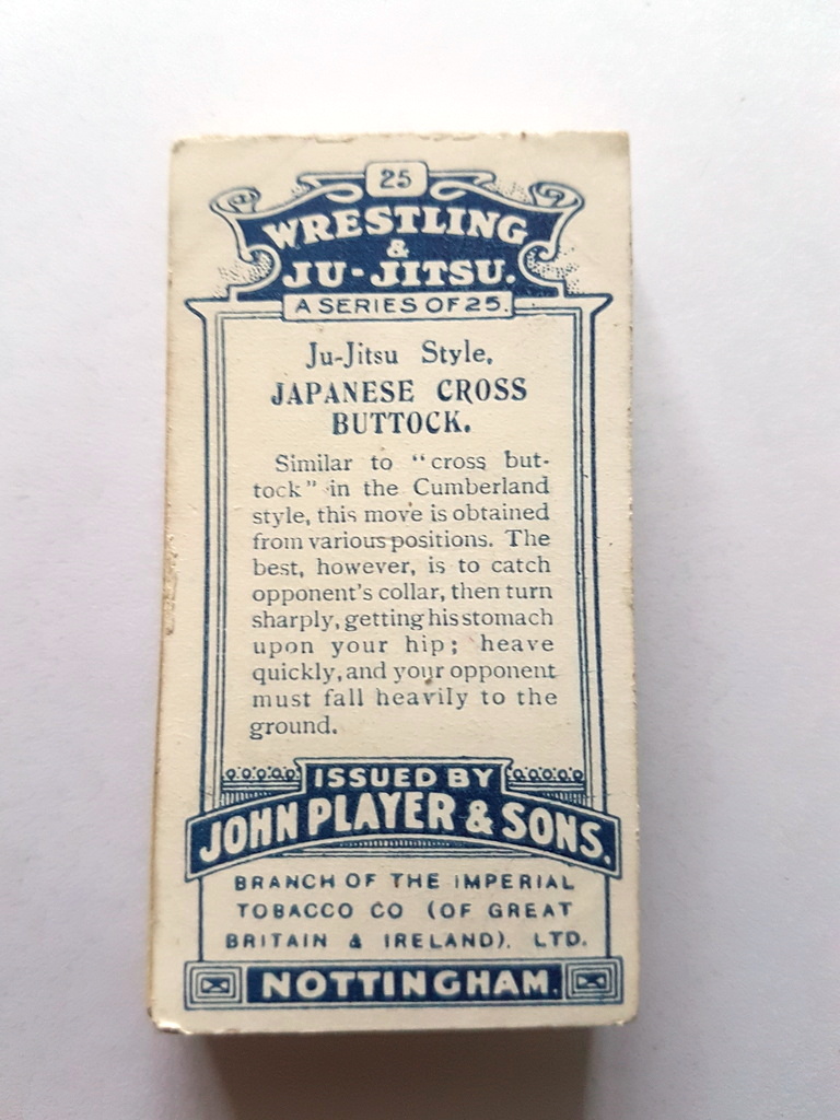 Photo of the back of these Wrestling & Ju-Jitsu (blue back) cigarette cards