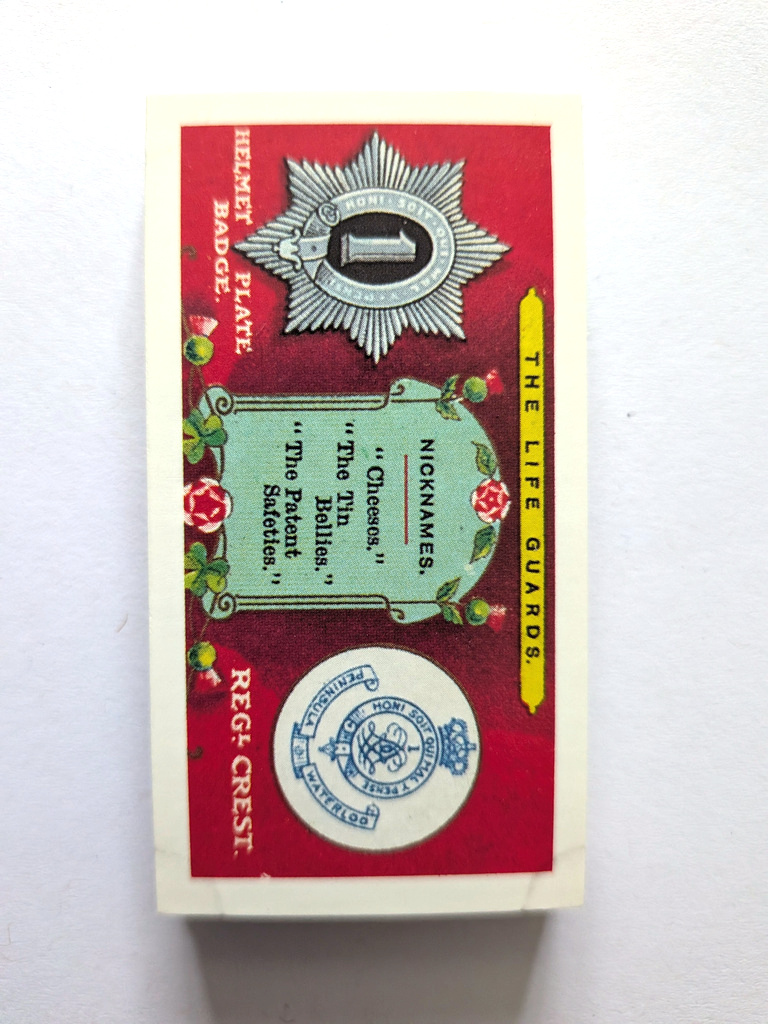 Photo of the front of these Regimental Crests, Nicknames and Collar Badges trade cards